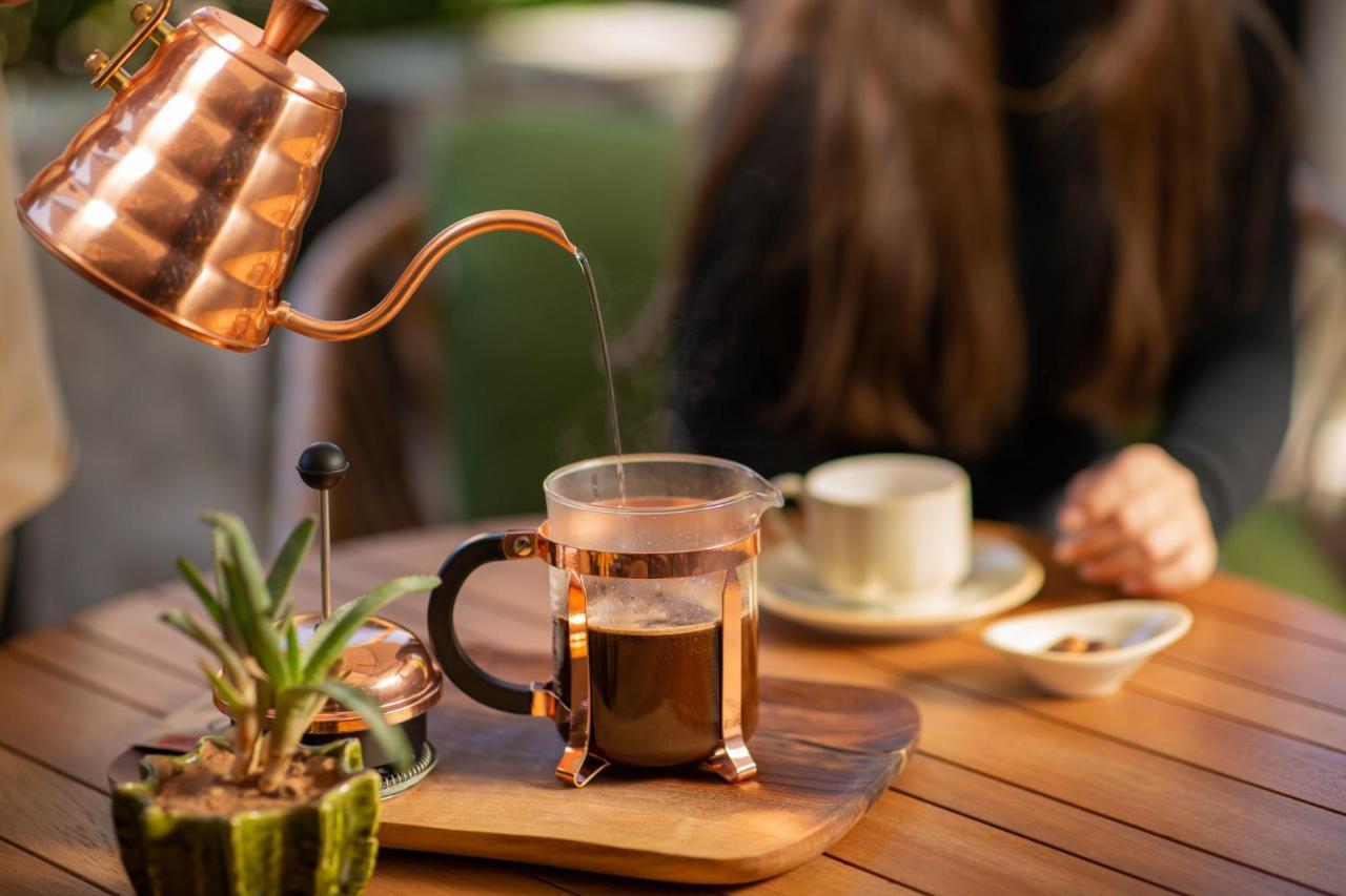 Hotel Jadali & Spa Marrakesh Exterior photo A copper kettle and a glass cup